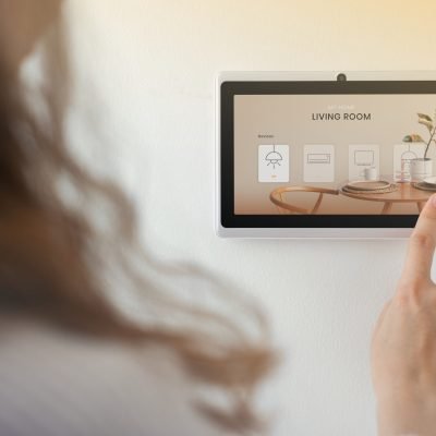Smart home innovation technology with woman using control panel
